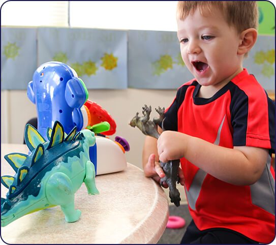 Child playing with toys at toddler daycare in Cumming