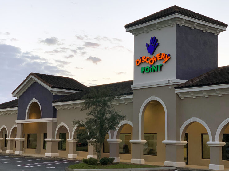 Discovery Point daycare franchise exterior at dusk